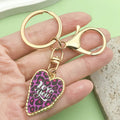 Heart Charm Keychains Featuring Purple Heart Across 18 Pictured Variations view 1