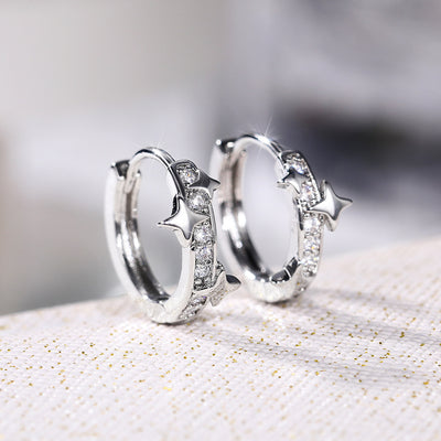 Silver Tone star and moon hoops shown in front detail view