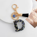 Shell-Chip Resin Letter Keychain with Evil Eye Charm and Tassel view 6