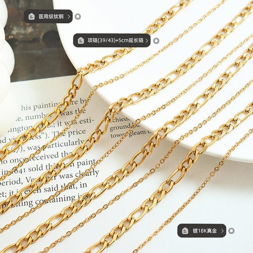 Gold Figaro and fine chains with material and length labels
