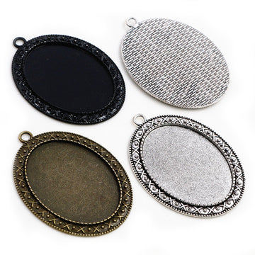 Oval Pendant Bezel Trays with Decorative Borders in Three Finishes