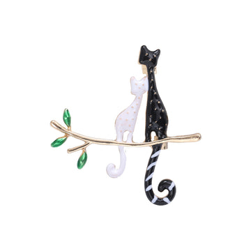 Black and White Cats on Branch Brooch with Green Leaves