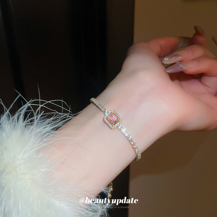 Gold Tone Crystal Slider Bracelet With Pale Pink Rectangular Center Stone