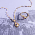 Gold Tone Ornate Geometric Pendant Necklace With Purple Stones view 1