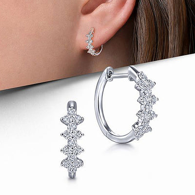Silver marquise CZ huggie hoops product shot with ear model inset