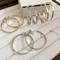 Oversized Polished Hoop Earrings with Distinctive Textured Details view 2