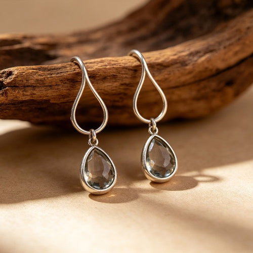 Silver-tone open loop earrings with smoky faceted drops