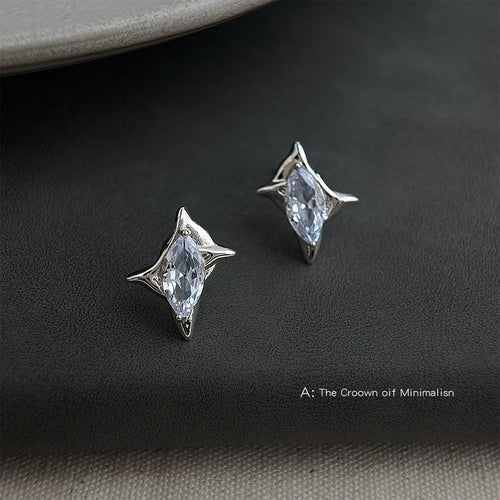 Silver marquise starburst studs on dark gray fabric