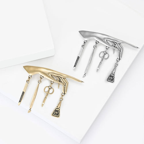 Manicure Tool brooch shown in angled product view