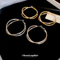 Twisted Double Hoop Earrings in Gold and Silver Tones view 4