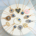 Assorted Crystal Evil Eye and Hamsa Pendant Necklaces in Twelve Designs view 1