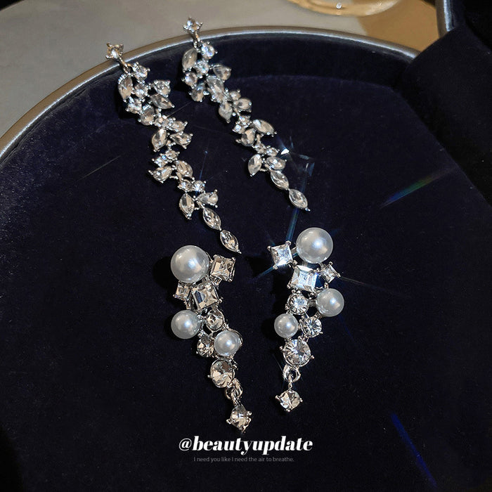 Silver Tone Crystal Leaf And Pearl Drop Earrings With Polished Metal Tone Details
