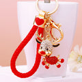 Mixed Christmas Deer Snowman and Jeweled Santa Hat Keychains with Red Loops view 1
