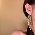 Crystal Waterfall Tassel Drop Earrings in Gold Tone view 2