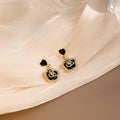 Black Heart and Camellia Flower Clear Look Drop Earrings view 2