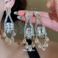 Clear Crystal Chandelier Earrings in Gold and Silver Tone view 2