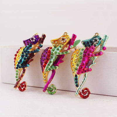 Three colorful rhinestone chameleon pendants displayed side by side.