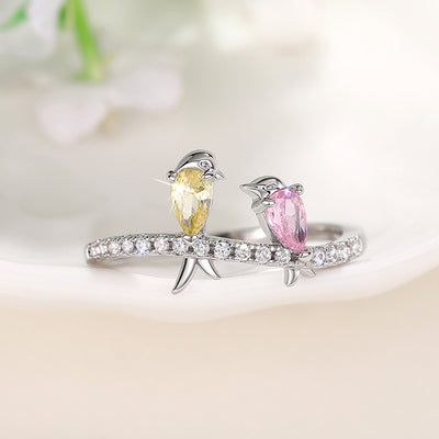 Silver twin bird ring pink yellow stones front view
