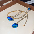 Gold Open Arm Cuffs With Large Oval Faceted Stones Trio view 1