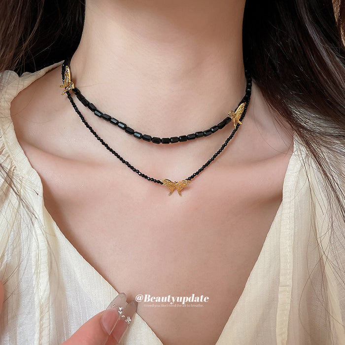 Black Beaded Double Strand Necklace With Gold Butterflies