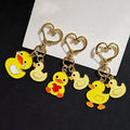 Yellow Duck Pair Heart-Clasp Charms in Three Designs view 1