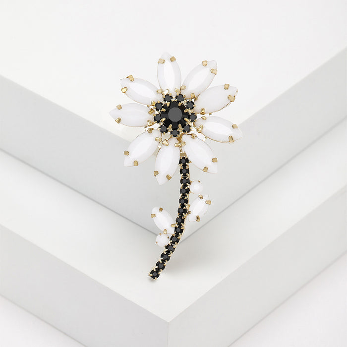 White Marquise Petal Flower Brooch With Black Crystal Stem