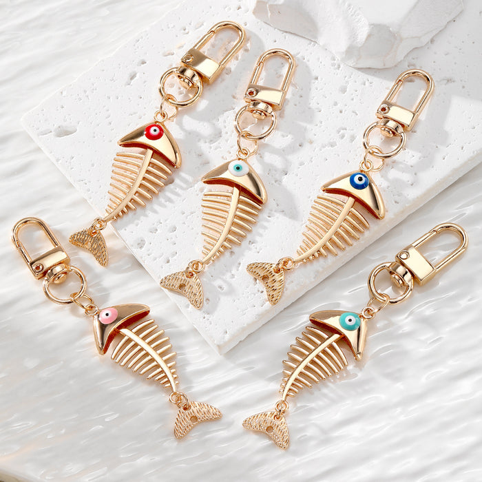 Gold Tone Fish Skeleton Evil Eye Clip Keychains in Five Colors