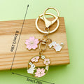 Cat Charm Keychains Featuring Pink Blossom Across 19 Pictured Variations view 3