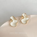 Gold Tone White Pearlescent Abstract Organic Shape Stud Earrings view 4