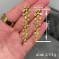 Gold Tone Leaf Branch Long Drop Earrings with Clear Stone Accents view 4
