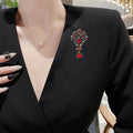 Ornate Crystal Dangle Brooch An Ornate Scrollwork Brooch view 2