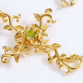 Gold Vine Leaf Cross Pendant Necklace Green Center Stone view 4