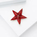 Faceted Red Five Point Star Brooch with Gold Outline view 3