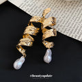 Sculpted Gold Pearl Drop Earrings in Polished Statement Design view 2