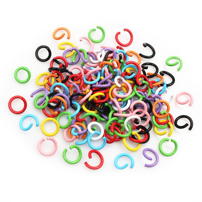 color-coated open jump ring assortment on a light background