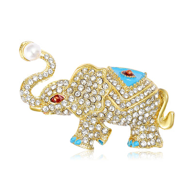 Front view of the crystal elephant brooch showing a gold-tone walking elephant covered in clear crystals with blue and r