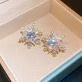 Crystal Snowflake Stud Earrings in Gold and Silver Tones view 6