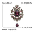 Teardrop Glass Brooch With Ornate Antique Tone Crystal Frame view 6