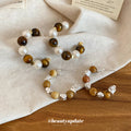 Brown And White Beaded Hoop Earrings In Two Patterns view 3