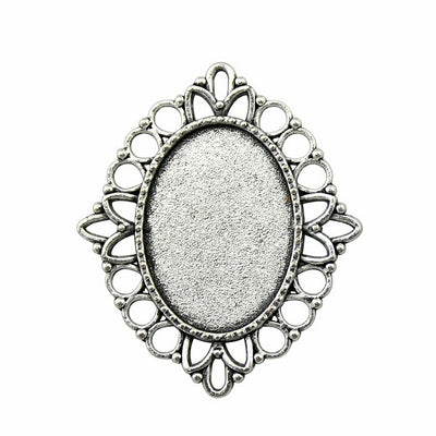 Silver Tone Openwork Oval Cabochon Pendant Tray Setting shown in image 1 with a looped openwork border