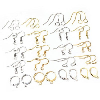 Assorted assorted metal ear wire hooks in multiple styles and finishes arranged together in the main product view