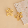 Thirty-Five Gold Tone Floral and Sculptural Stud Earrings view 3