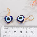Gold Tone Heart-Shaped Blue Evil Eye Necklace and Huggie Earrings view 2