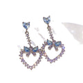 Crystal Bow and Open Heart Drop Stud Earrings With Metal Details view 5