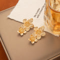 Gold Tone Double Flower Textured Long Dangle Stud Earrings view 2