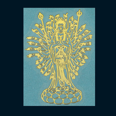 The many-armed gold-tone standing figure is shown again on its lotus base.