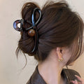 Gunmetal Tone Sculptural Loop Hair Claw With Large Round Bead Detail view 3