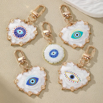 Gold Tone White Heart and Round Evil Eye Clip Keychains