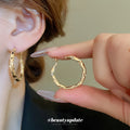 Irregular Textured Hoop Earrings in Gold and Silver Tones view 1