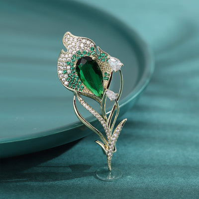 Green pavé tulip brooch gold-tone metal on teal plate